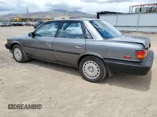 1990 Toyota Camry z VIN JT2VV21E2L0114723, wystawiony jako Copart lot #53584755 z przebiegiem 58 986 mil mil oraz Czysty tytuł • Clean title. Historia ofert i sprzedaży dostępna na DreamBid. Obrazek 2.