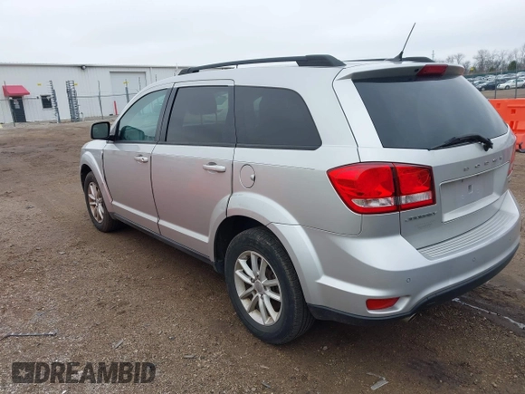 2013 Dodge Journey SXT with VIN 3C4PDCBG1DT647014, listed as a IAAI auction lot 42006636 with 192,911 mi miles. Bid and sale history available at carsss.com. Image 3.
