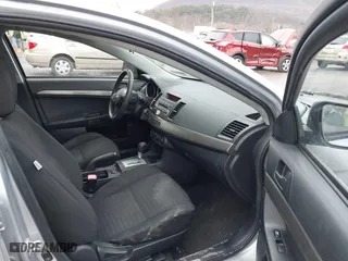 2013 Mitsubishi Lancer SE with VIN JA32V2FW7DU015061, listed as a IAAI auction lot 41863621 with 141,315 mi miles. Bid and sale history available at carsss.com. Image 5.