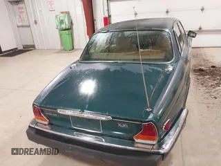 1985 Jaguar XJ with VIN SAJAV1347FC414864, listed as a IAAI auction lot 42118511 with 117,185 mi miles and . Bid and sale history available at DreamBid. Image 16.