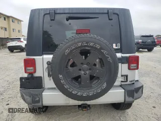 2010 Jeep Wrangler Unlimited Sahara with VIN 1J4BA5H17AL117410, listed as a Copart auction lot 88519555 with 126,471 mi miles and Salvage Title. Bid and sale history available at carsss.com. Image 6.