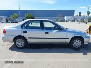 1999 Honda Civic LX with VIN JHMEJ6670XS000958, listed as a IAAI auction lot 41620949 with 93,698 mi miles and . Bid and sale history available at DreamBid. Image 13.