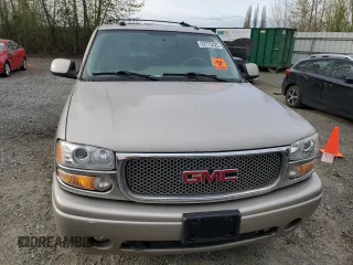2005 GMC Yukon Denali z VIN 1GKEK63U65J262371, wystawiony jako Copart lot #52773425 z przebiegiem 129 028 mil mil oraz Czysty tytuł • Clean title. Historia ofert i sprzedaży dostępna na DreamBid. Obrazek 5.
