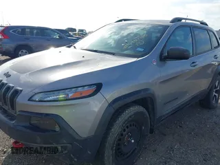 2015 Jeep Cherokee Trailhawk with VIN 1C4PJMBS3FW662307, listed as a IAAI auction lot 41778932 with 64,569 mi miles. Bid and sale history available at carsss.com. Image 6.