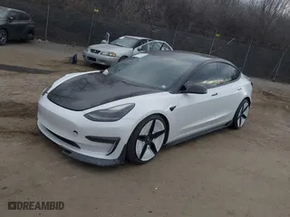 2021 Tesla Model 3 Performance with VIN 5YJ3E1EC5MF059625, listed as a IAAI auction lot 41652748 with 63,287 mi miles. Bid and sale history available at carsss.com. Image 21.