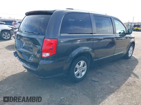 2011 Dodge Grand Caravan Crew with VIN 2D4RN5DG3BR660235, listed as a IAAI auction lot 41945522 with 148,924 mi miles and . Bid and sale history available at DreamBid. Image 4.