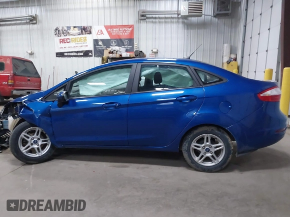 2019 Ford Fiesta SE z VIN 3FADP4BJXKM118427, wystawiony jako IAAI lot #41643927 z przebiegiem 109 617 mil mil oraz . Historia ofert i sprzedaży dostępna na DreamBid. Obrazek 13.