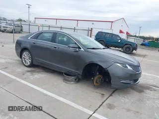 2016 Lincoln MKZ z VIN 3LN6L2J94GR629759, wystawiony jako IAAI lot #41056490 z przebiegiem 124 892 mil mil oraz . Historia ofert i sprzedaży dostępna na DreamBid. Obrazek 1.