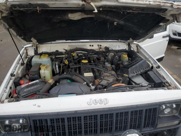 1996 Jeep Cherokee Sport with VIN 1J4FJ68S9TL284984, listed as a Copart auction lot 86307644 with 136,142 mi miles and Salvage Title. Bid and sale history available at carsss.com. Image 11.