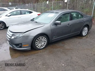 2012 Ford Fusion Hybrid with VIN 3FADP0L34CR215667, listed as a IAAI auction lot 41957936 with 158,914 mi miles and . Bid and sale history available at DreamBid. Image 2.