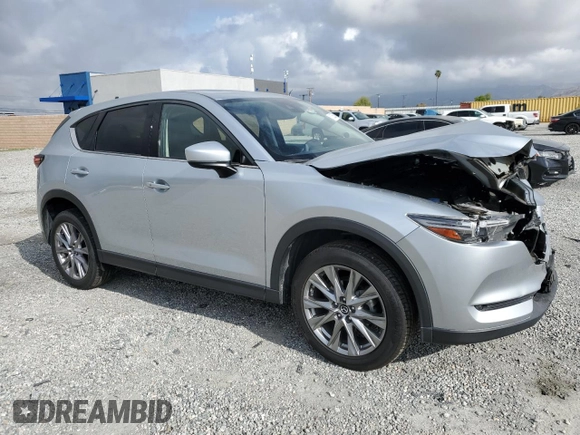 2020 Mazda CX-5 Grand Touring with VIN JM3KFADM5L0732193, listed as a Copart auction lot 51325385 with 86,798 mi miles and Salvage Title. Bid and sale history available at DreamBid. Image 4.