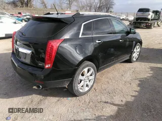 2016 Cadillac SRX Performance Collection z VIN 3GYFNCE32GS505552, wystawiony jako IAAI lot #40949642 z przebiegiem 143 343 mil mil oraz . Historia ofert i sprzedaży dostępna na DreamBid. Obrazek 4.