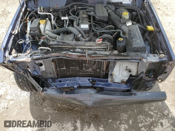 1997 Jeep Cherokee SE with VIN 1J4FT27P0VL612859, listed as a Copart auction lot 49869915 with 198,702 mi miles and Salvage title. Bid and sale history available at DreamBid. Image 12.