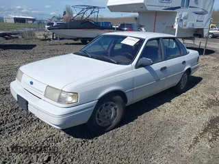 1993 Ford Tempo z VIN 1FAPP36X7PK153107, wystawiony jako IAAI lot #41867198 z przebiegiem 9377 mil mil oraz . Historia ofert i sprzedaży dostępna na DreamBid. Obrazek 2.