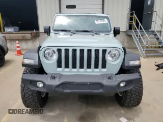 2023 Jeep Wrangler Sport with VIN 1C4HJXDN0PW643485, listed as a Copart auction lot 59783564 with 14,001 mi miles and Salvage Title. Bid and sale history available at DreamBid. Image 5.