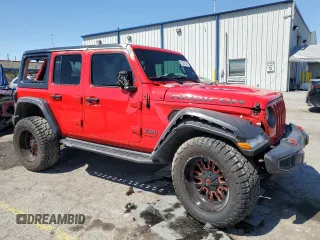 2019 Jeep Wrangler Unlimited Rubicon with VIN 1C4HJXFN7KW519171, listed as a Copart auction lot 56251325 with 69,094 mi miles and Salvage title. Bid and sale history available at DreamBid. Image 4.