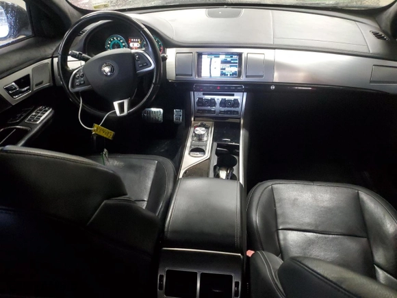 2015 Jaguar XF V6 Portfolio with VIN SAJWJ0FF4F8U76587, listed as a Copart auction lot 83678194 with 88,205 mi miles and Salvage Title. Bid and sale history available at carsss.com. Image 8.