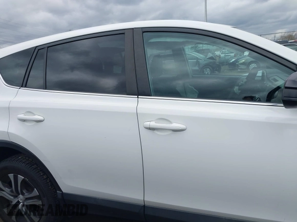 2018 Toyota RAV4 LE with VIN 2T3BFREVXJW793174, listed as a IAAI auction lot 42037936 with 82,304 mi miles. Bid and sale history available at carsss.com. Image 13.