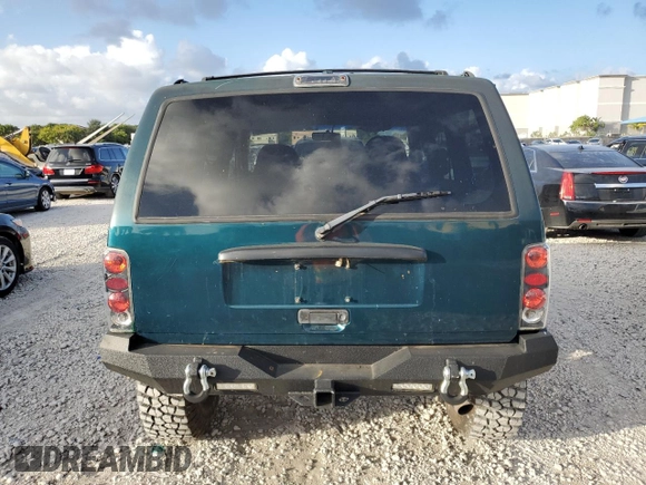 1998 Jeep Cherokee Country with VIN 1J4FT78S8XL520854, listed as a Copart auction lot 79304214 with 111,674 mi miles and Clean title. Bid and sale history available at DreamBid. Image 6.
