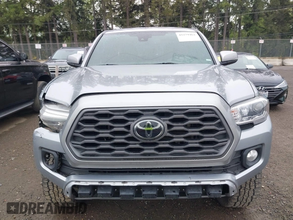 2020 Toyota Tacoma SR5 z VIN 3TMCZ5AN8LM323918, wystawiony jako IAAI lot #42279462 z przebiegiem 105 923 mil mil oraz . Historia ofert i sprzedaży dostępna na DreamBid. Obrazek 12.