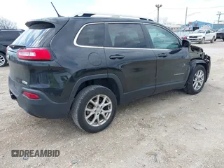 2014 Jeep Cherokee Latitude with VIN 1C4PJLCB6EW186576, listed as a IAAI auction lot 42099422 with 117,681 mi miles and . Bid and sale history available at DreamBid. Image 4.