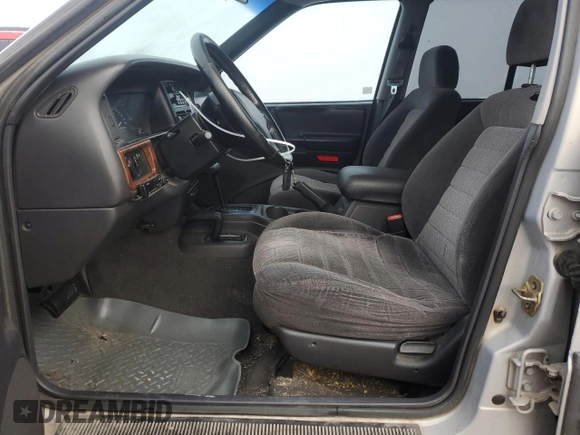 1997 Jeep Grand Cherokee Laredo with VIN 1J4GZ58Y6VC603370, listed as a Copart auction lot 82802794 with 0 mi miles and Salvage Title. Bid and sale history available at carsss.com. Image 7.