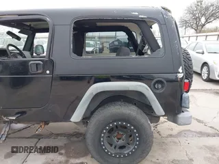2004 Jeep Wrangler Sport with VIN 1J4FA49S64P794559, listed as a IAAI auction lot 41644201 with 107,445 mi miles. Bid and sale history available at carsss.com. Image 20.