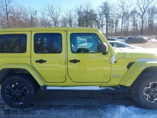 2023 Jeep Wrangler 4xe Sahara with VIN 1C4JJXP66PW580527, listed as a IAAI auction lot 41261127 with 15,100 mi miles. Bid and sale history available at carsss.com. Image 13.