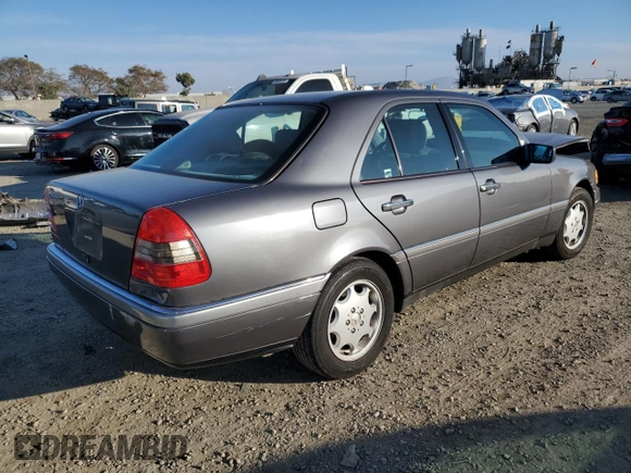 1997 Mercedes-Benz C with VIN WDBHA23E7VF545229, listed as a Copart auction lot 43518335 with 153,158 mi miles and Salvage title. Bid and sale history available at DreamBid. Image 3.