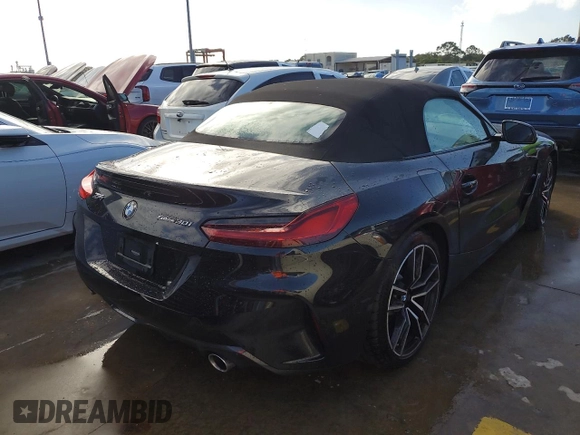 2020 BMW Z4 sDrive30i with VIN WBAHF3C06LWW75400, listed as a Copart auction lot 74297024 with 34,559 mi miles and Salvage Title. Bid and sale history available at carsss.com. Image 3.