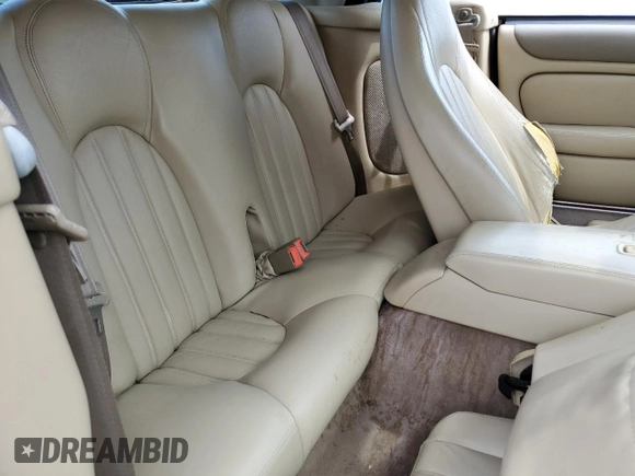 1999 Jaguar XK z VIN SAJGX2044XC031383, wystawiony jako Copart lot #54726925 z przebiegiem 107 696 mil mil oraz Szkody całkowita. Historia ofert i sprzedaży dostępna na DreamBid. Obrazek 10.