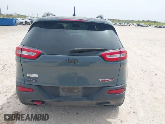 2015 Jeep Cherokee Trailhawk with VIN 1C4PJMBS0FW524479, listed as a IAAI auction lot 41908871 with 118,825 mi miles and . Bid and sale history available at DreamBid. Image 16.