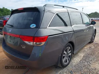 2015 Honda Odyssey Touring Elite z VIN 5FNRL5H97FB060981, wystawiony jako IAAI lot #42289631 z przebiegiem 160 947 mil mil oraz . Historia ofert i sprzedaży dostępna na DreamBid. Obrazek 4.
