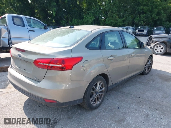 2016 Ford Focus SE z VIN 1FADP3F29GL361006, wystawiony jako IAAI lot #42387418 z przebiegiem 132 806 mil mil oraz . Historia ofert i sprzedaży dostępna na DreamBid. Obrazek 4.