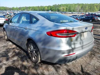 2019 Ford Fusion SE with VIN 3FA6P0HD0KR192915, listed as a IAAI auction lot 41980996 with 128,336 mi miles. Bid and sale history available at carsss.com. Image 3.