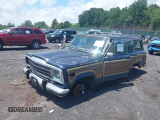 1988 Jeep Grand Wagoneer with VIN 1JCNJ15U7JT237152, listed as a IAAI auction lot 42682009 with 159,950 mi miles and . Bid and sale history available at DreamBid. Image 2.