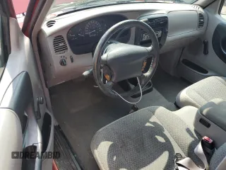 1999 Ford Ranger XL with VIN 1FTYR14V2XPB56627, listed as a Copart auction lot 57036435 with 215,050 mi miles and Salvage title. Bid and sale history available at DreamBid. Image 8.
