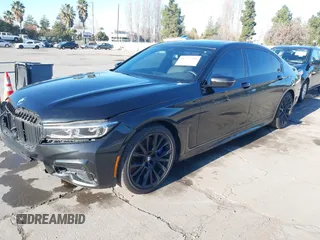2022 BMW 7 Series 740i with VIN WBA7T2C02NCJ33925, listed as a IAAI auction lot 41377788 with 143,684 mi miles and . Bid and sale history available at carsss.com. Image 2.