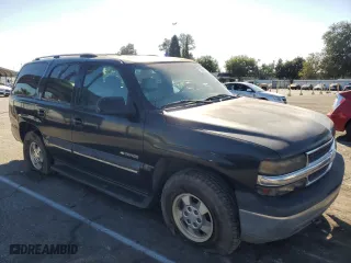 2001 Chevrolet Tahoe LS with VIN 1GNEK13T71R170422, listed as a Copart auction lot 77896614 with 341,774 mi miles and Salvage Title. Bid and sale history available at carsss.com. Image 4.