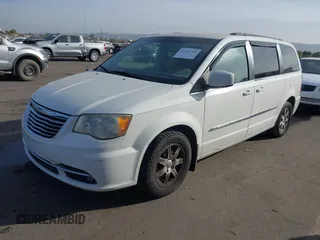 2012 Chrysler Town & Country Touring z VIN 2C4RC1BGXCR410507, wystawiony jako IAAI lot #41215704 z przebiegiem 161 501 mil mil oraz . Historia ofert i sprzedaży dostępna na DreamBid. Obrazek 2.