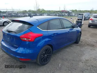 2018 Ford Focus Titanium z VIN 1FADP3N26JL325931, wystawiony jako IAAI lot #42096503 z przebiegiem 106 338 mil mil oraz . Historia ofert i sprzedaży dostępna na DreamBid. Obrazek 4.