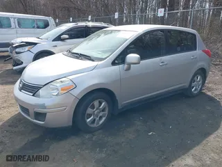 2009 Nissan Versa 1.8 SL with VIN 3N1BC13E19L418874, listed as a IAAI auction lot 41698587 with 154,568 mi miles. Bid and sale history available at carsss.com. Image 2.