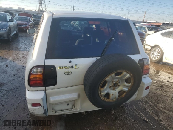 1999 Toyota RAV4 with VIN JT3GP10V7X7063436, listed as a Copart auction lot 42700055 with 159,001 mi miles and Salvage Title. Bid and sale history available at DreamBid. Image 6.