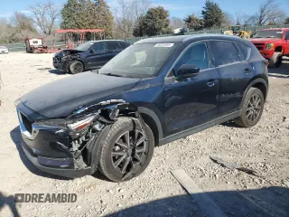 2018 Mazda CX-5 Grand Touring with VIN JM3KFADM4J1341740, listed as a Copart auction lot 46805955 with 99,114 mi miles and Salvage Title. Bid and sale history available at DreamBid. Image 1.