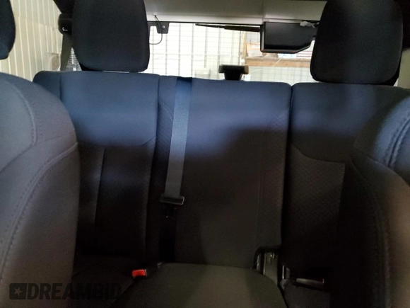2015 Jeep Wrangler Unlimited Freedom with VIN 1C4BJWDG5FL713046, listed as a Copart auction lot 58563455 with 144,179 mi miles and Salvage title. Bid and sale history available at DreamBid. Image 10.