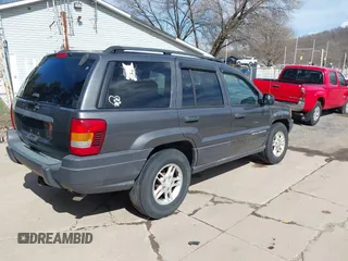 2003 Jeep Grand Cherokee Laredo with VIN 1J4GX48S53C504225, listed as a IAAI auction lot 41879669 with 247,246 mi miles. Bid and sale history available at carsss.com. Image 4.