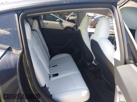 2024 Tesla Model Y Performance with VIN 7SAYGDEF1RA329825, listed as a IAAI auction lot 41762602 with 3,923 mi miles and . Bid and sale history available at DreamBid. Image 8.