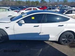 2021 Tesla Model S Long Range with VIN 5YJSA1E56MF453711, listed as a IAAI auction lot 41467603 with 115,634 mi miles and . Bid and sale history available at DreamBid. Image 14.