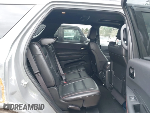 2023 Dodge Durango GT Plus with VIN 1C4RDHDG3PC601932, listed as a IAAI auction lot 41238697 with 56,294 mi miles and . Bid and sale history available at DreamBid. Image 8.