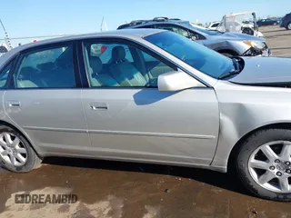 2001 Toyota Avalon XL z VIN 4T1BF28B51U189775, wystawiony jako IAAI lot #41970356 z przebiegiem 247 969 mil mil oraz . Historia ofert i sprzedaży dostępna na DreamBid. Obrazek 14.